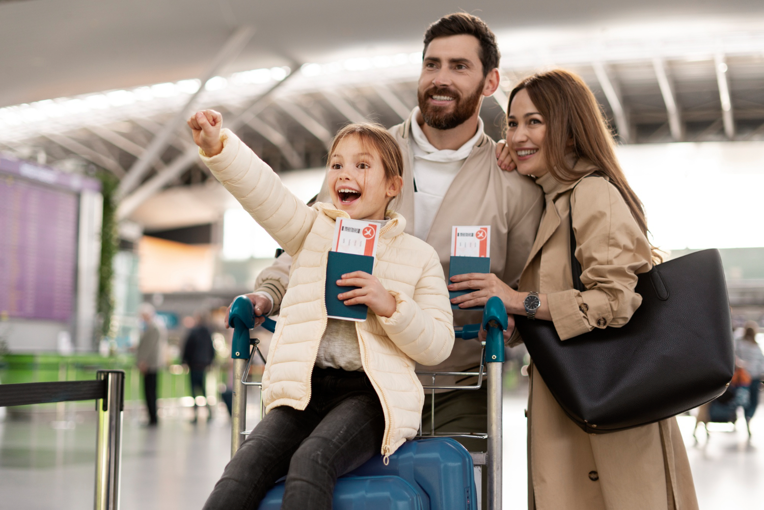 Family at airport with airline tickets and passport